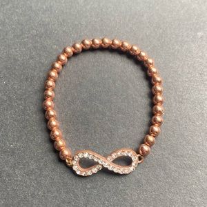 ⚠️ Rose gold toned beaded infinity bracelet with rhinestone accents